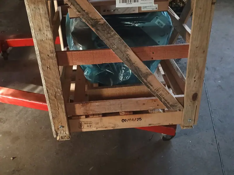 A remanufactured unit still crated and strapped, in off the truck
